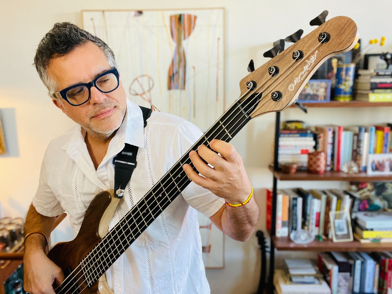 Bassist Carlos Henriquez plays his Overwater Hybrid 5 string bass